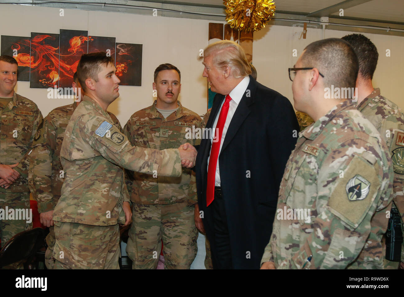 U.S. President Donald Trump greets U.S. service members during a surprise visit to al-Asad Air Base December 26, 2018 in Al Anbar, Iraq. The president and the first lady spent about three hours on Boxing Day at Al Asad, located in western Iraq, their first trip to visit troops overseas since taking office. Stock Photo