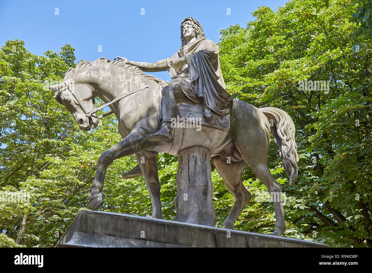 Equestrian statue of Louis XIII by Jean-Pierre Cortot (1787-1843) in a sunny summer day in Paris, France Stock Photo