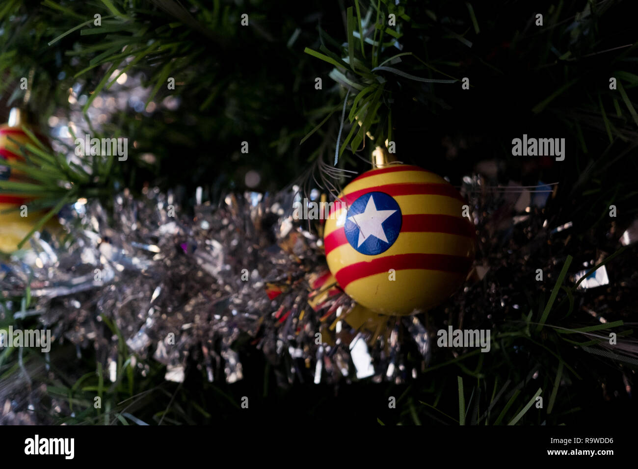 christmas decoration ball on tree with traditional catalan  estrellada flag on it Stock Photo
