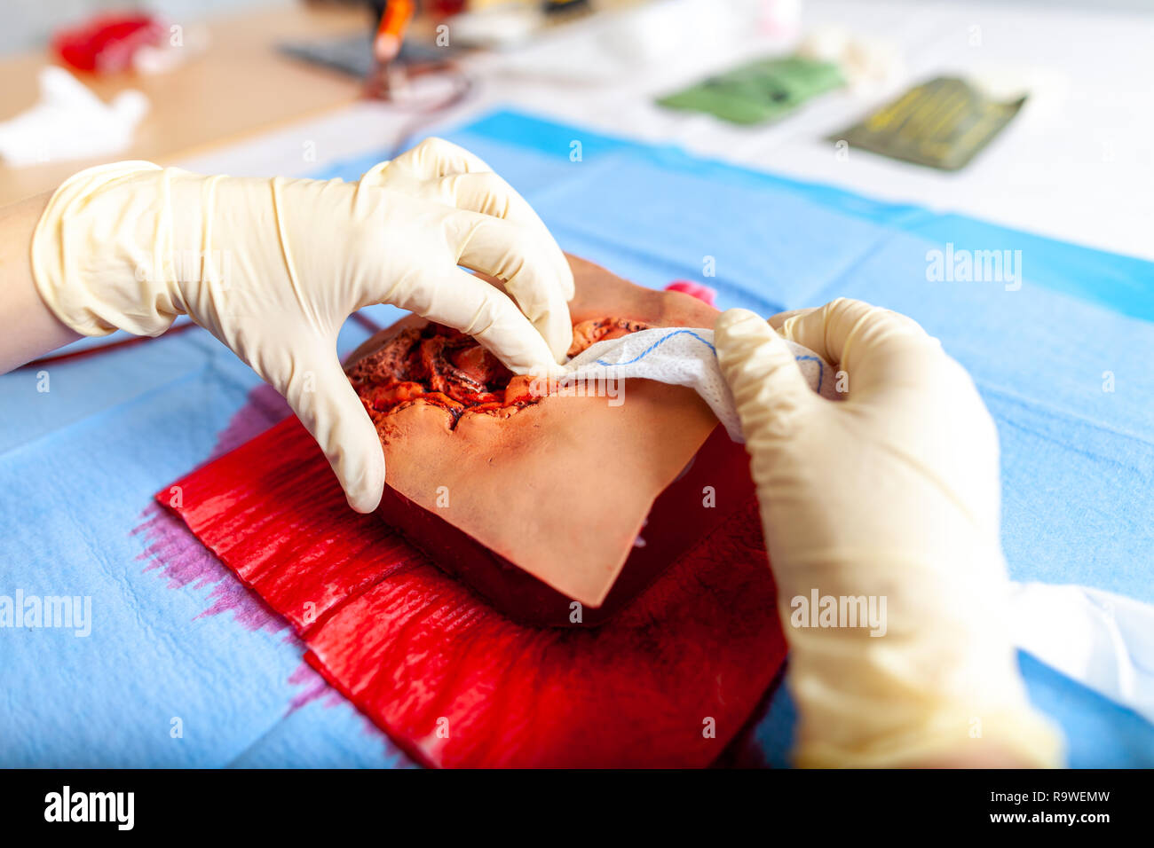 German military medic practice bleeding control on a wound dummy Stock Photo