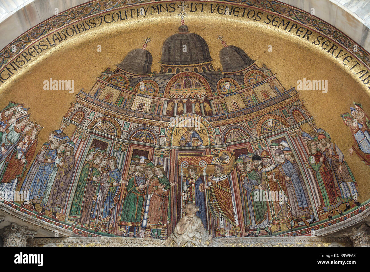 Transfer of the Body of Saint Mark to Saint Mark's Basilica. Byzantine mosaic dated from the 13th century in the lunette over the entrance to Saint Mark's Basilica (Basilica di San Marco) on Piazza San Marco in Venice, Italy. Stock Photo
