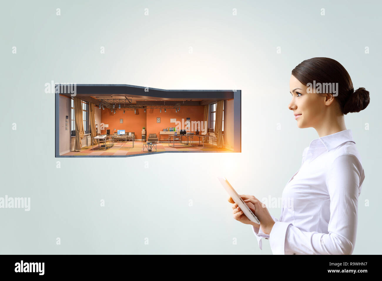 Woman using tablet pc. Mixed media Stock Photo
