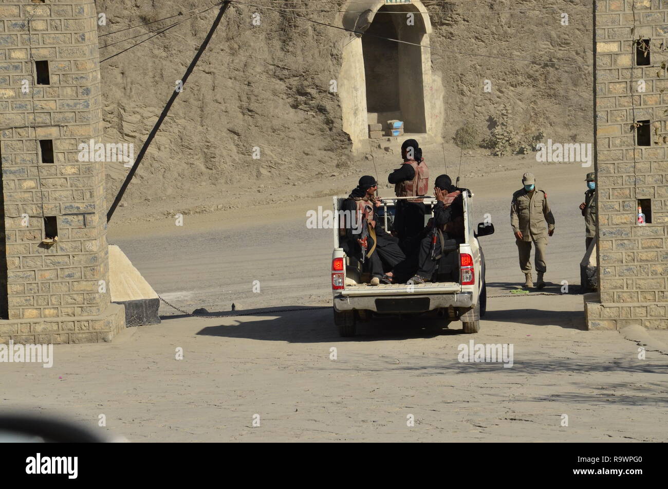 Pakistan army personnel patrol near the border with Afghanistan at Torkham border crossing in KPK province. Stock Photo
