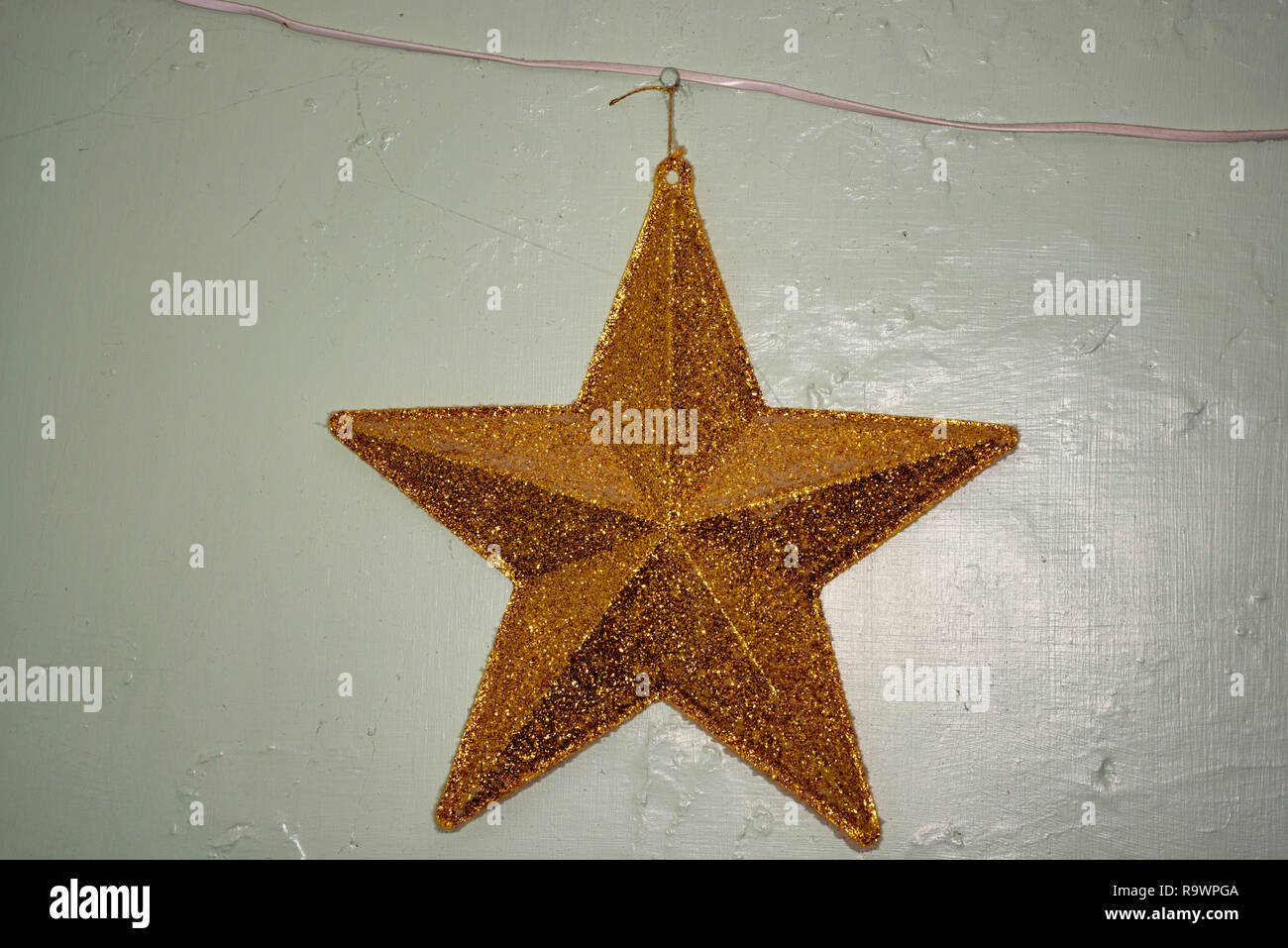 Gold coloured star, Christmas decoration Stock Photo