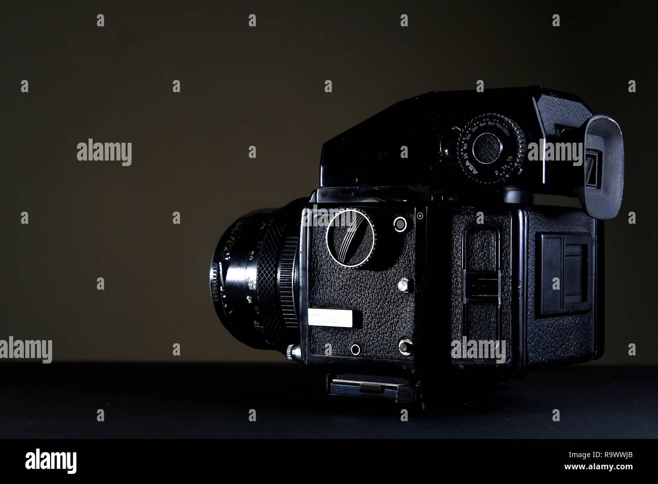 A vintage medium format film camera shot with dramatic lighting and