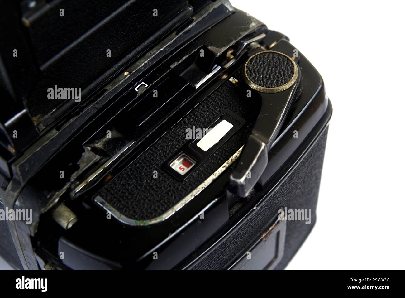 Close up shot of the film cartridge and film advance crank or lever of