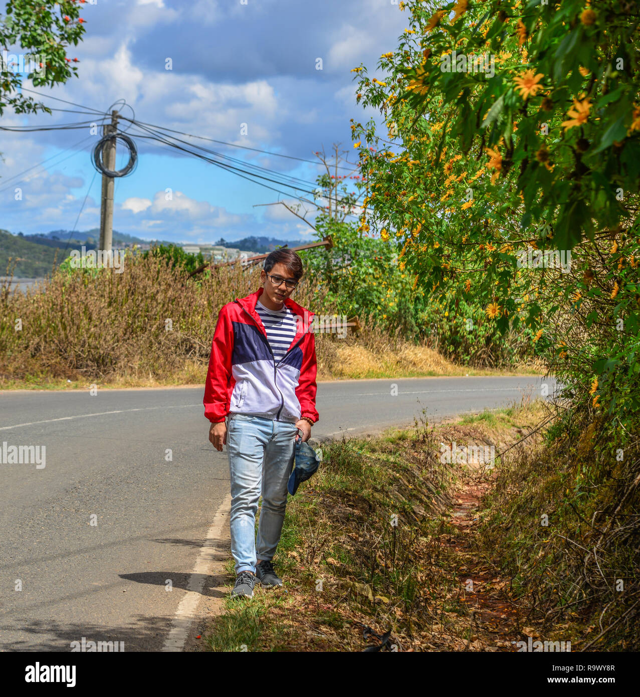 Man walking on winding road hi-res stock photography and images - Alamy