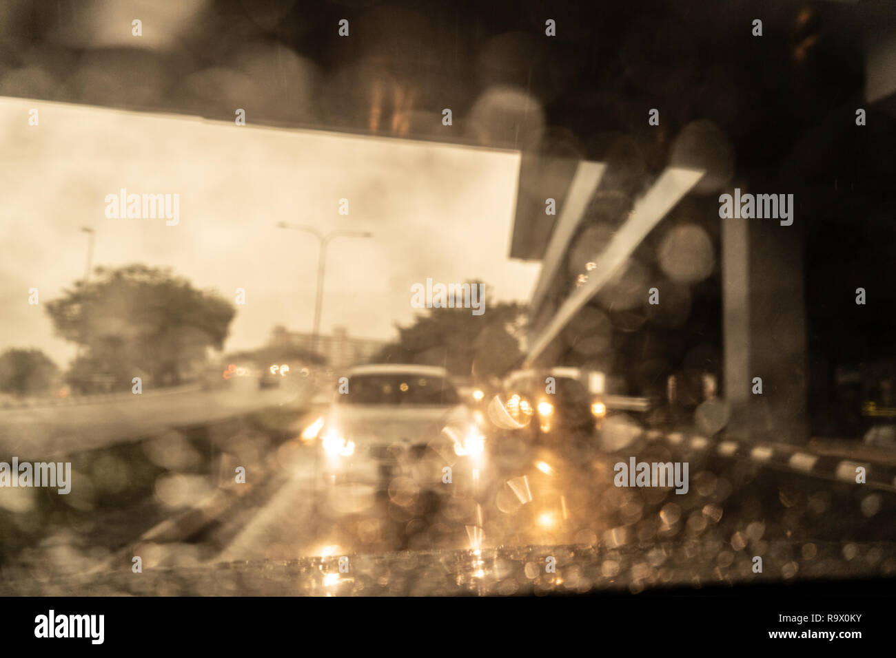 rain droplets on car windshield, traffic in city Stock Photo - Alamy