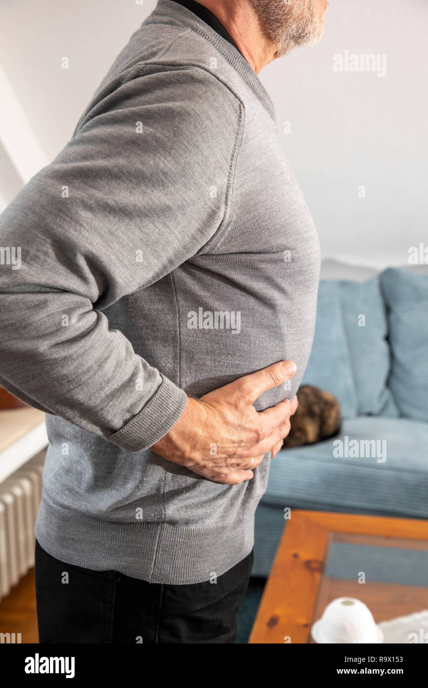 Symbolic picture of diverticular disease and diverticulitis, painful protrusions of the intestinal inner wall through the intestinal musculature Stock Photo