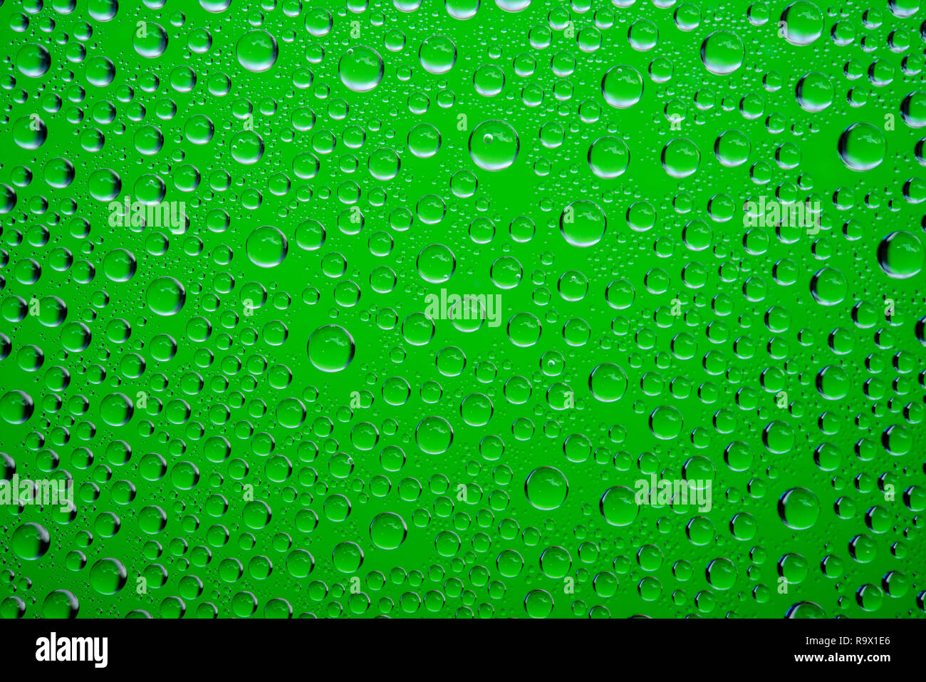 Green water drops background close up Stock Photo Alamy