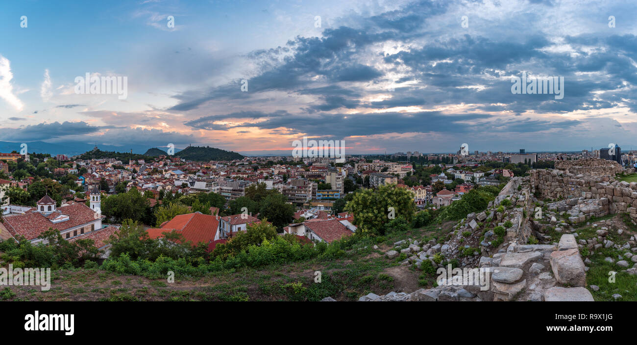 Summer sunset over Plovdiv, Bulgaria, European capital of culture 2019. Photo from one of the hills in the city with walls from ancient fortress. Stock Photo