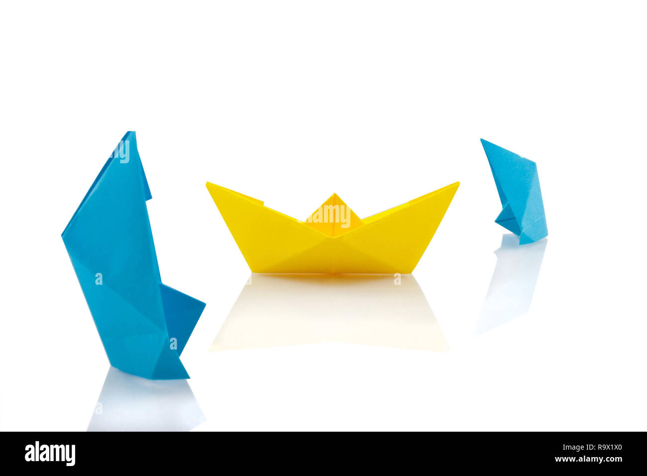 Sinking ships, origami concept Stock Photo