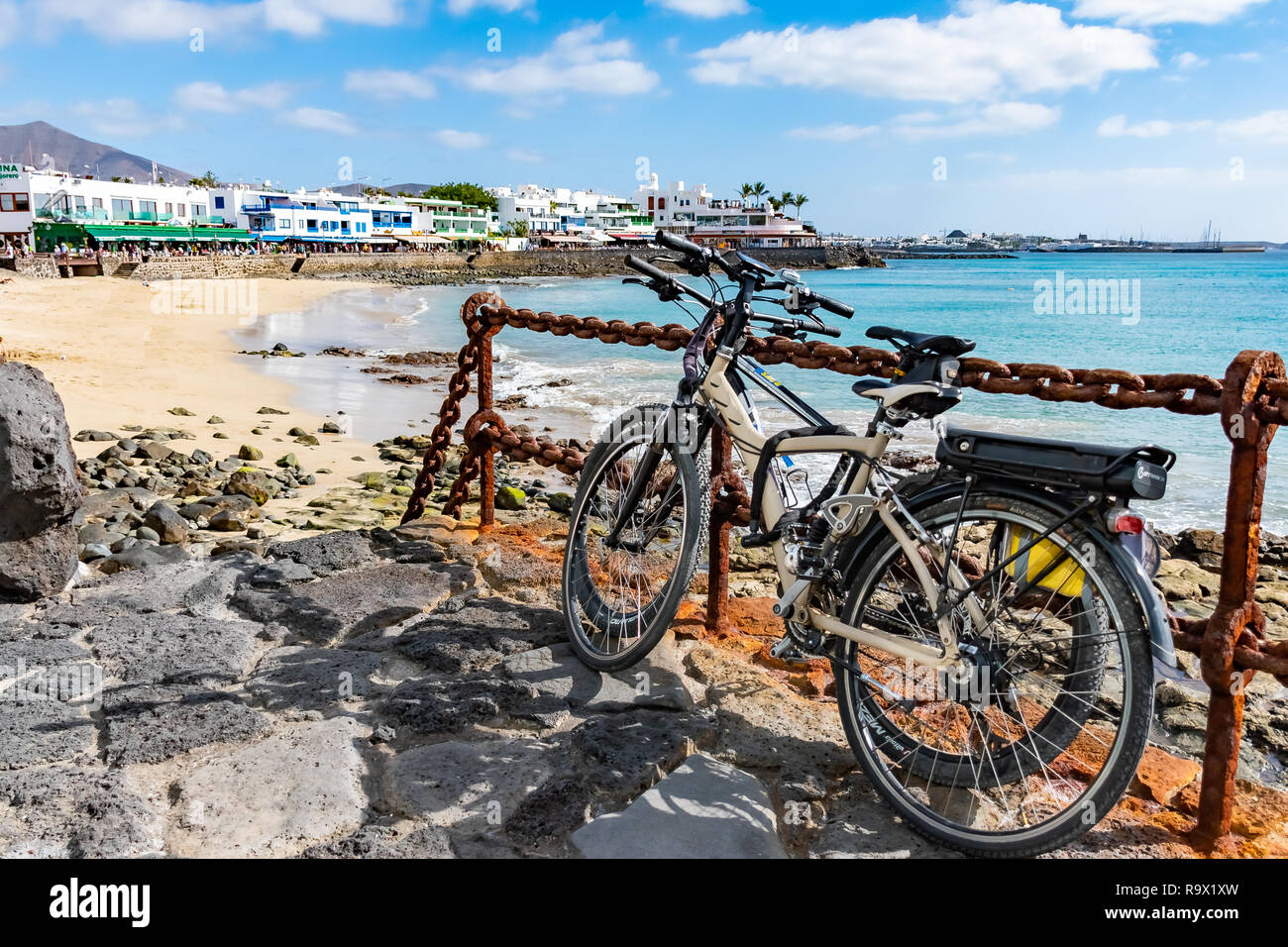 Bikes or Cycles at seaside promenade in Playa Blanca, the former fishermens village became a main touristic spot with opening of the new harbor, Lanza Stock Photo