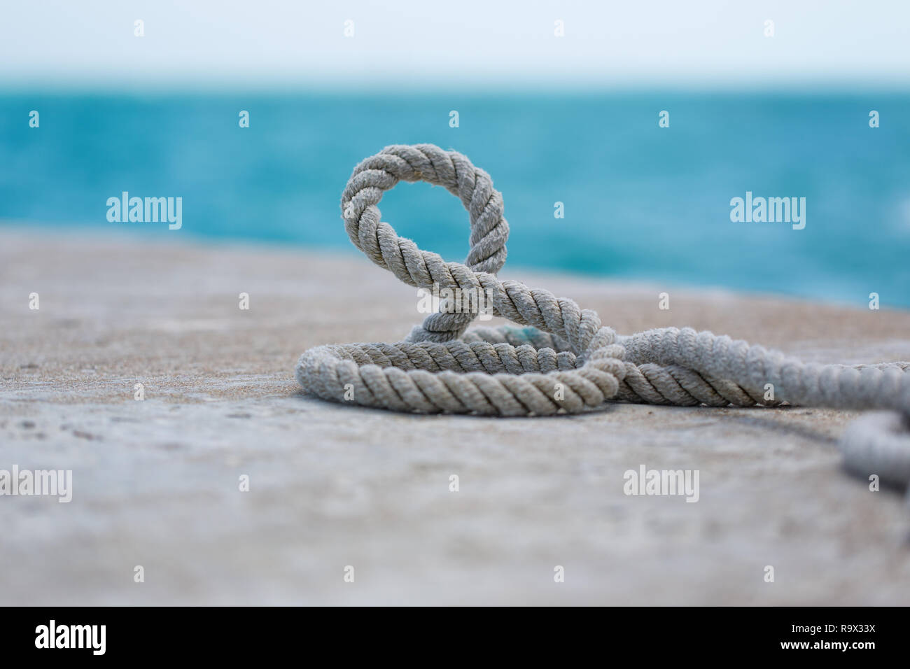 Seaman's rope. Wrapped on the ground. Stock Photo