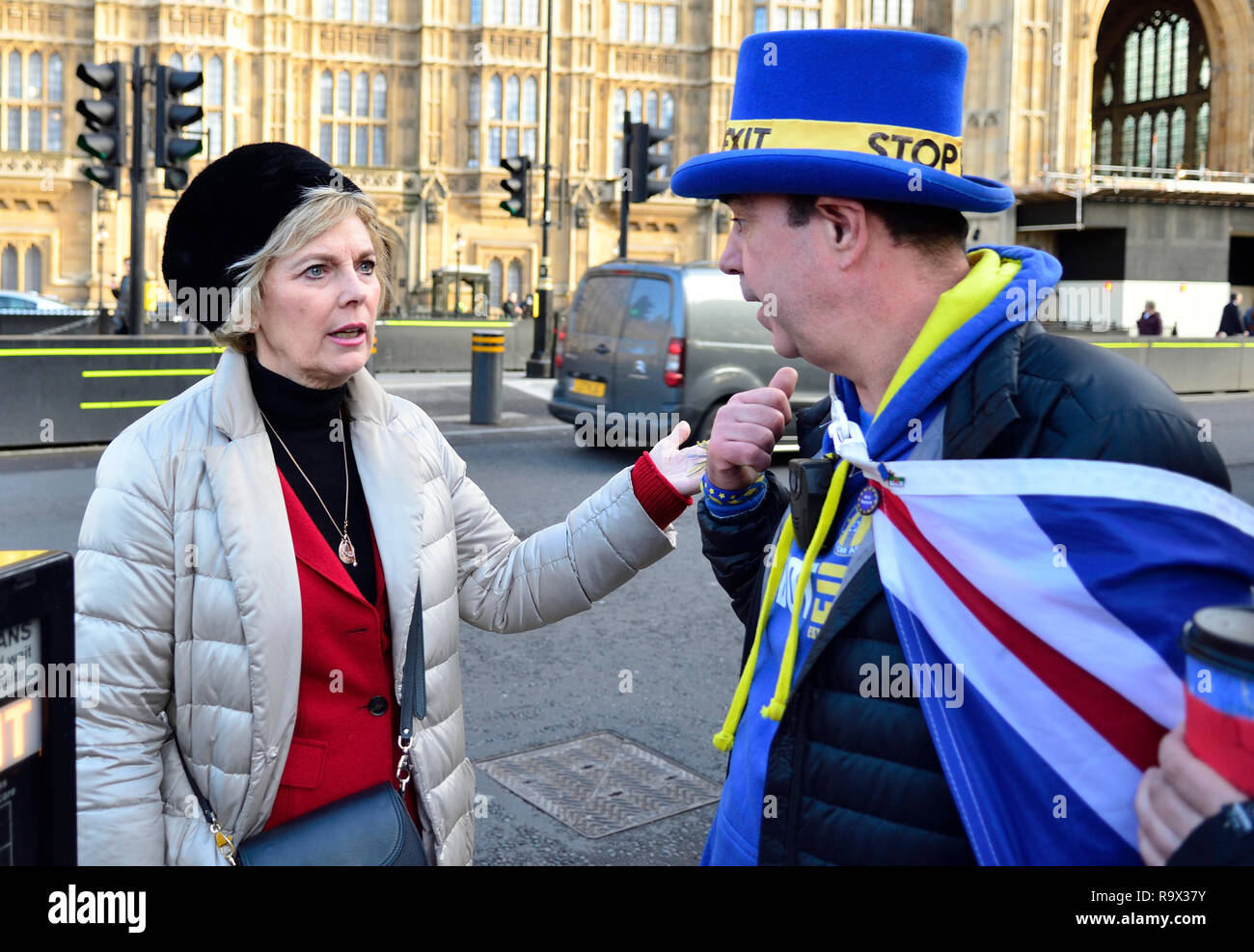 Anna Soubry MP (Con: Broxtowe) talking to anti-Brexit campaigner Steve Bray of SODEM across the road from Parliament, 19th Dec 2018 Stock Photo