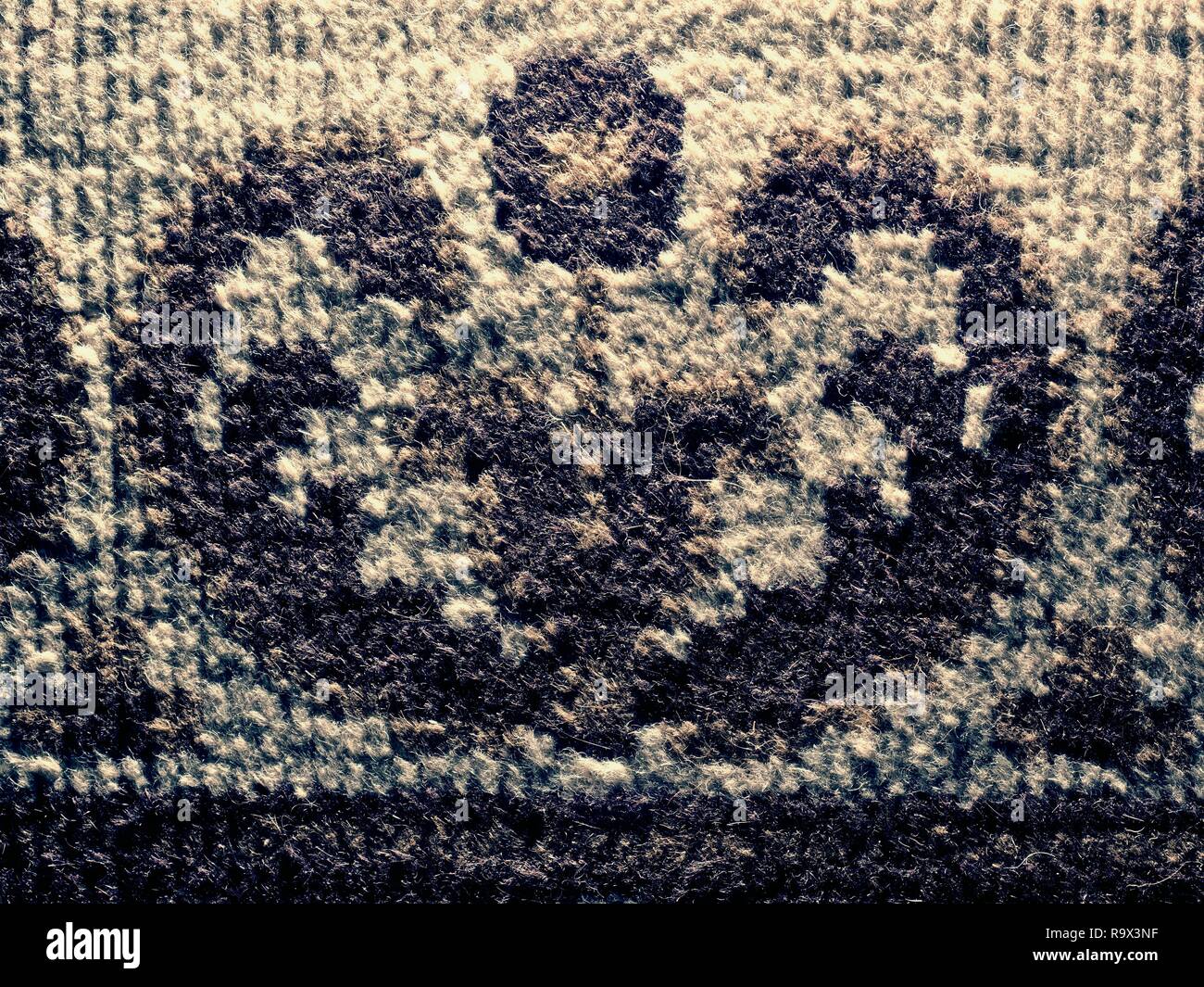Old worn carpet in detail. Weaving texture or weaving pattern