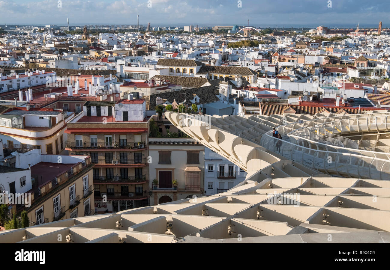 The Metropol Parasol in the old historic quarter of Seville, Spain, is a large wooden mushroom shaped structure popular with tourists to the city. Stock Photo
