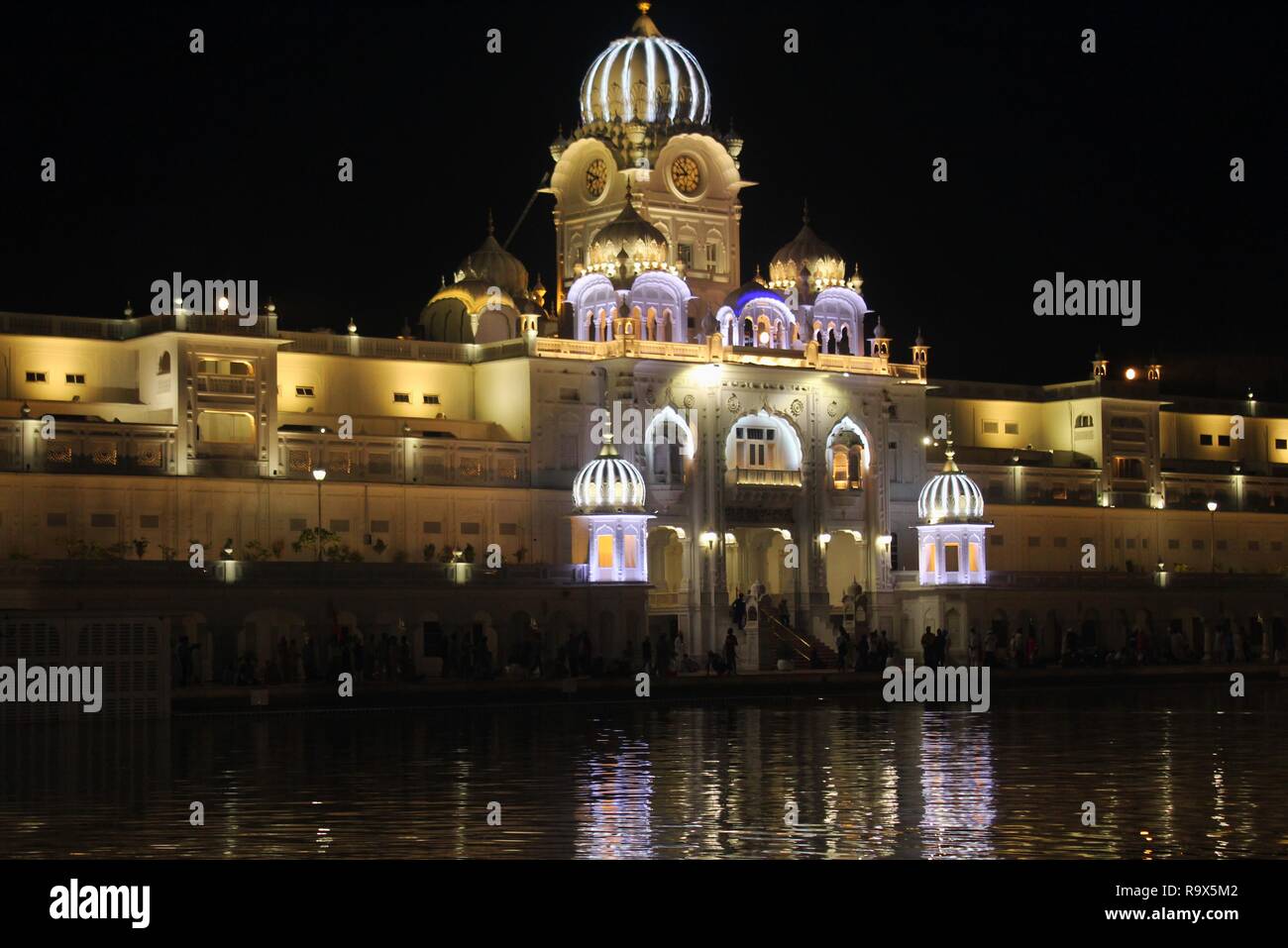 Golden temple entrance at night Stock Photo