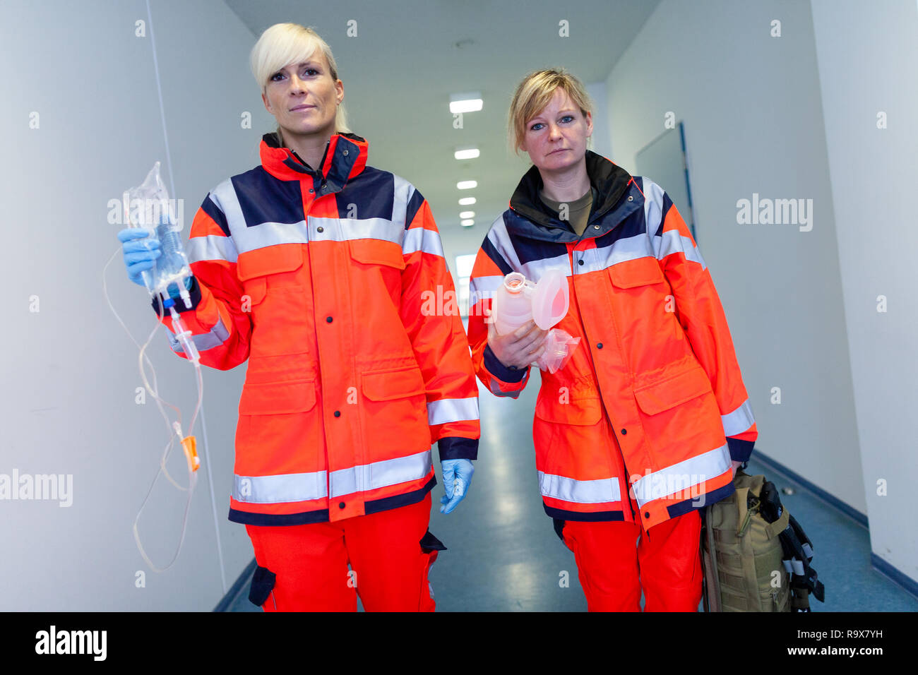 two female paramedics with emergency equipment in a floor Stock Photo