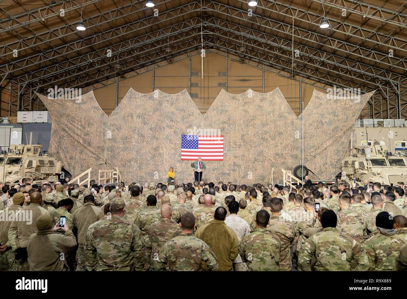 U.S. President Donald Trump addresses U.S. service members during a surprise visit to Al Asad Air Base December 26, 2018 in Al Anbar, Iraq. The president and the first lady spent about three hours on Boxing Day at Al Asad, located in western Iraq, their first trip to visit troops overseas since taking office. Stock Photo