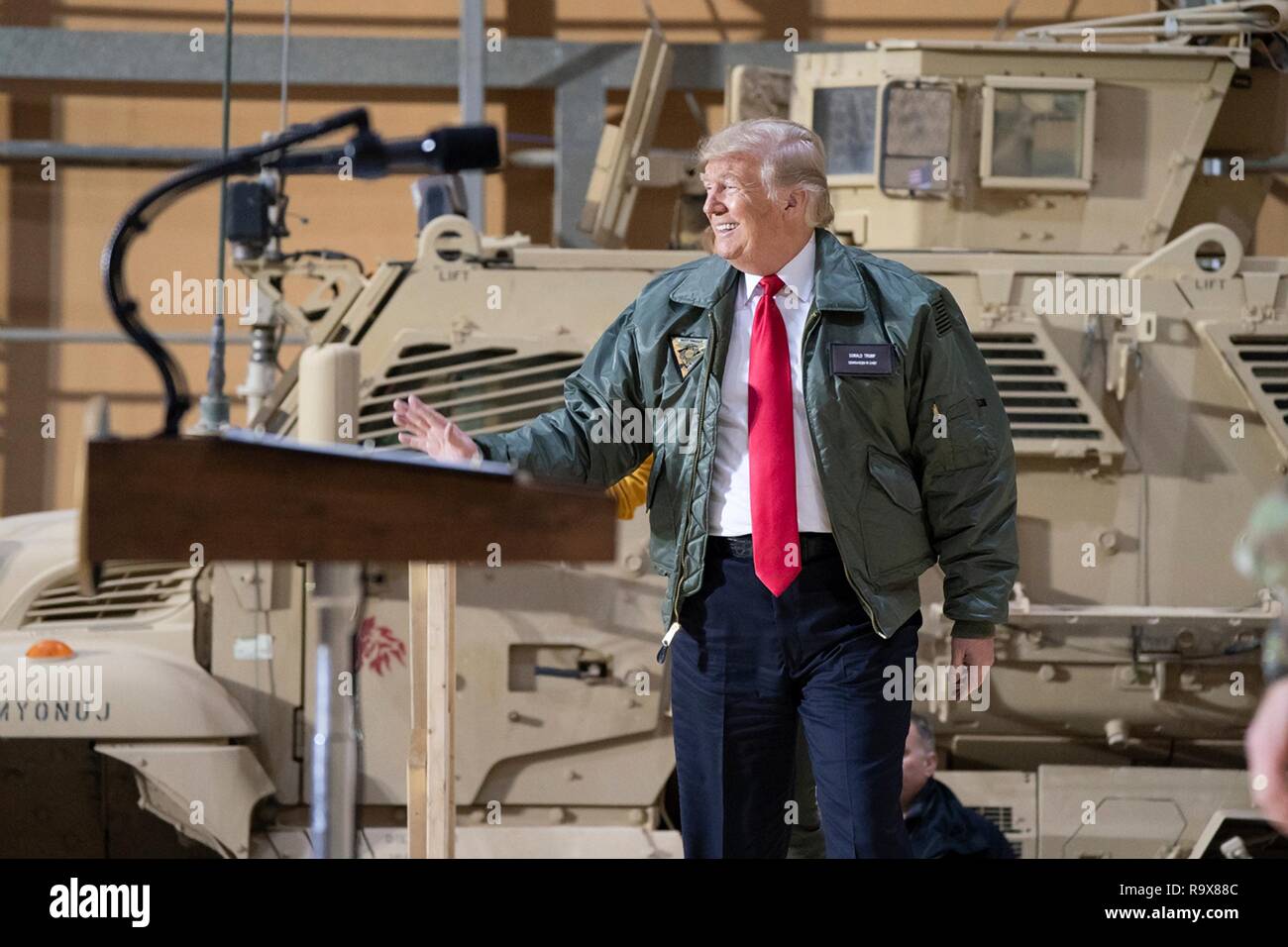 U.S. President Donald Trump addresses U.S. service members during a surprise visit to Al Asad Air Base December 26, 2018 in Al Anbar, Iraq. The president and the first lady spent about three hours on Boxing Day at Al Asad, located in western Iraq, their first trip to visit troops overseas since taking office. Stock Photo