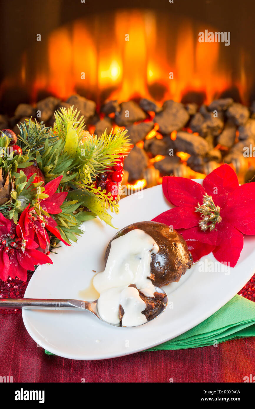 Traditional Christmas pudding with Brandy sauce. Stock Photo