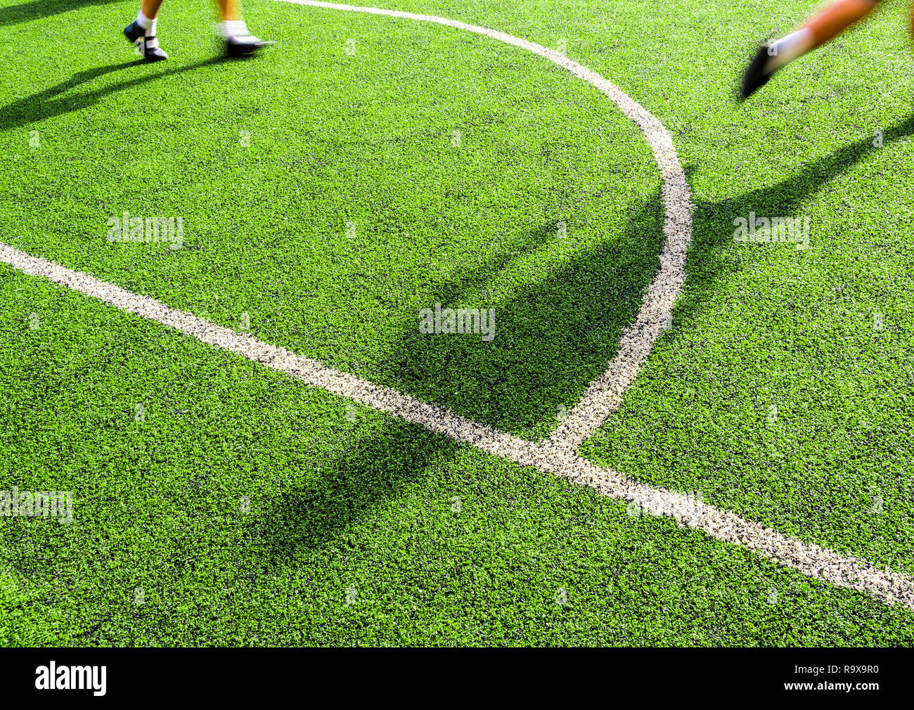 Children play on the artificial turf of the school Stock Photo - Alamy