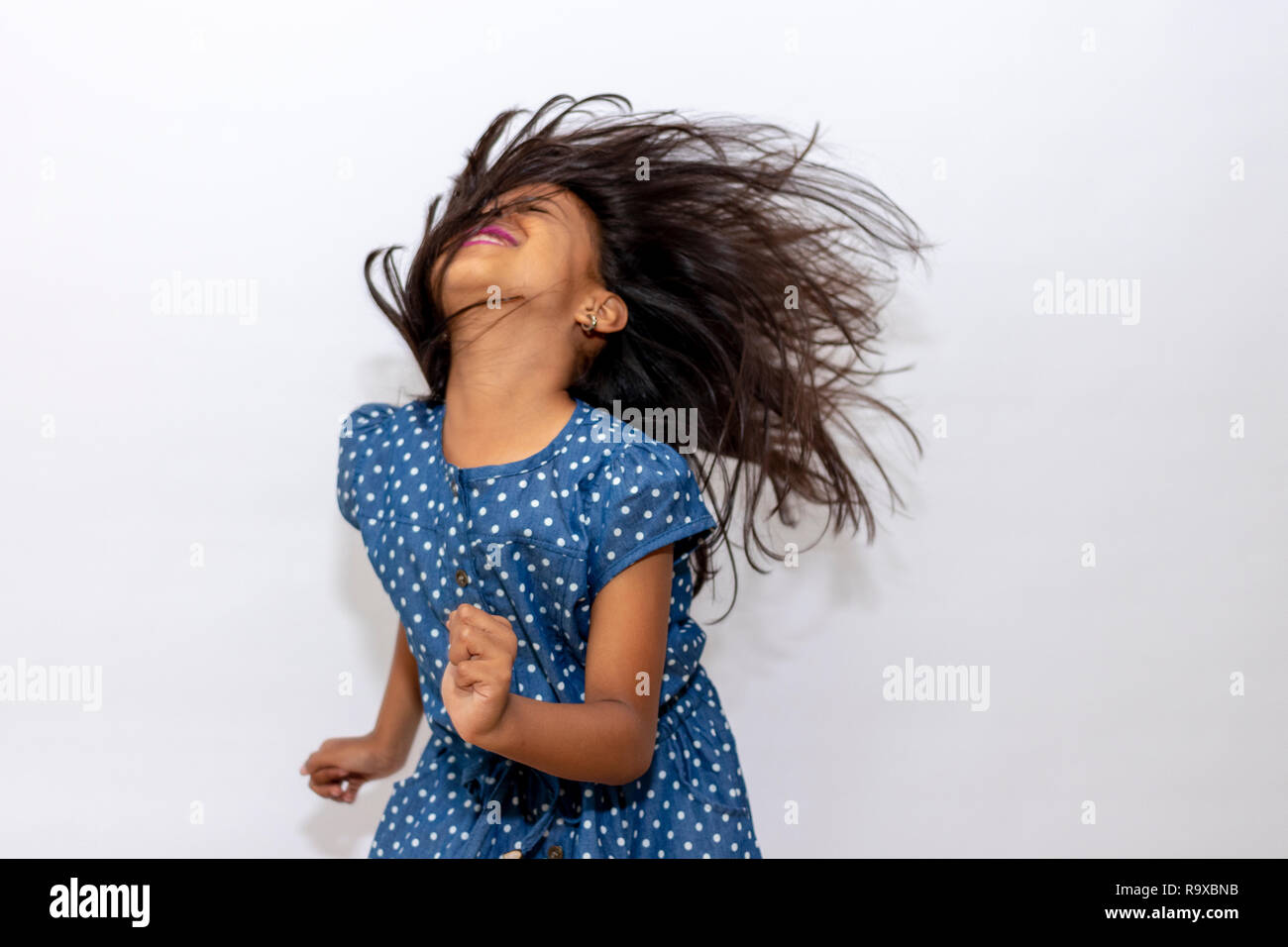Little girl playing with her hair Stock Photo - Alamy