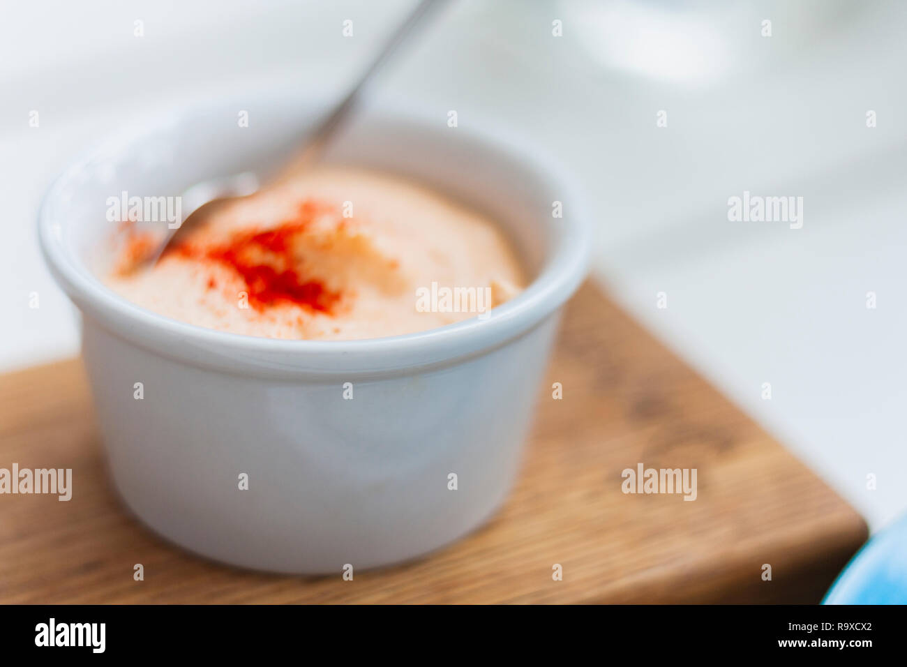 Sauce in small whire bowl for traditional meze dinner. Stock Photo