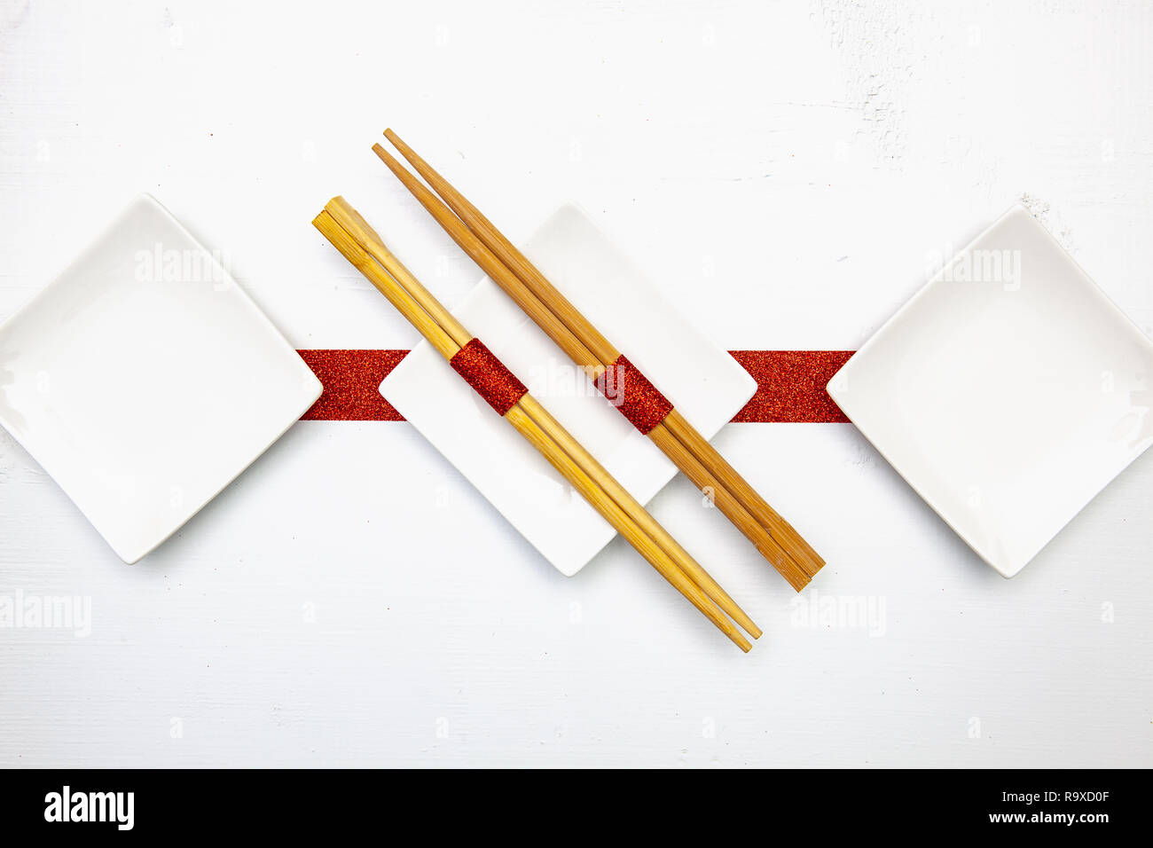 Ceramic Bowls And Bamboo Chopsticks For Sushi Food With Red And