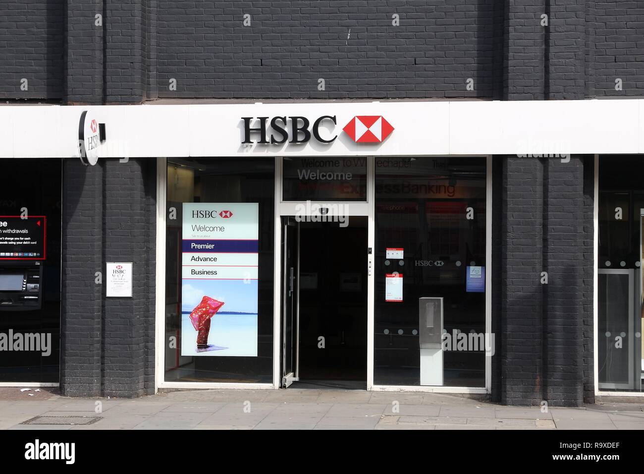 LONDON, UK - JULY 6, 2016: HSBC Bank branch in London. HSBC was established in Hong Kong in 1865. Currently it is headquartered in the UK. Stock Photo