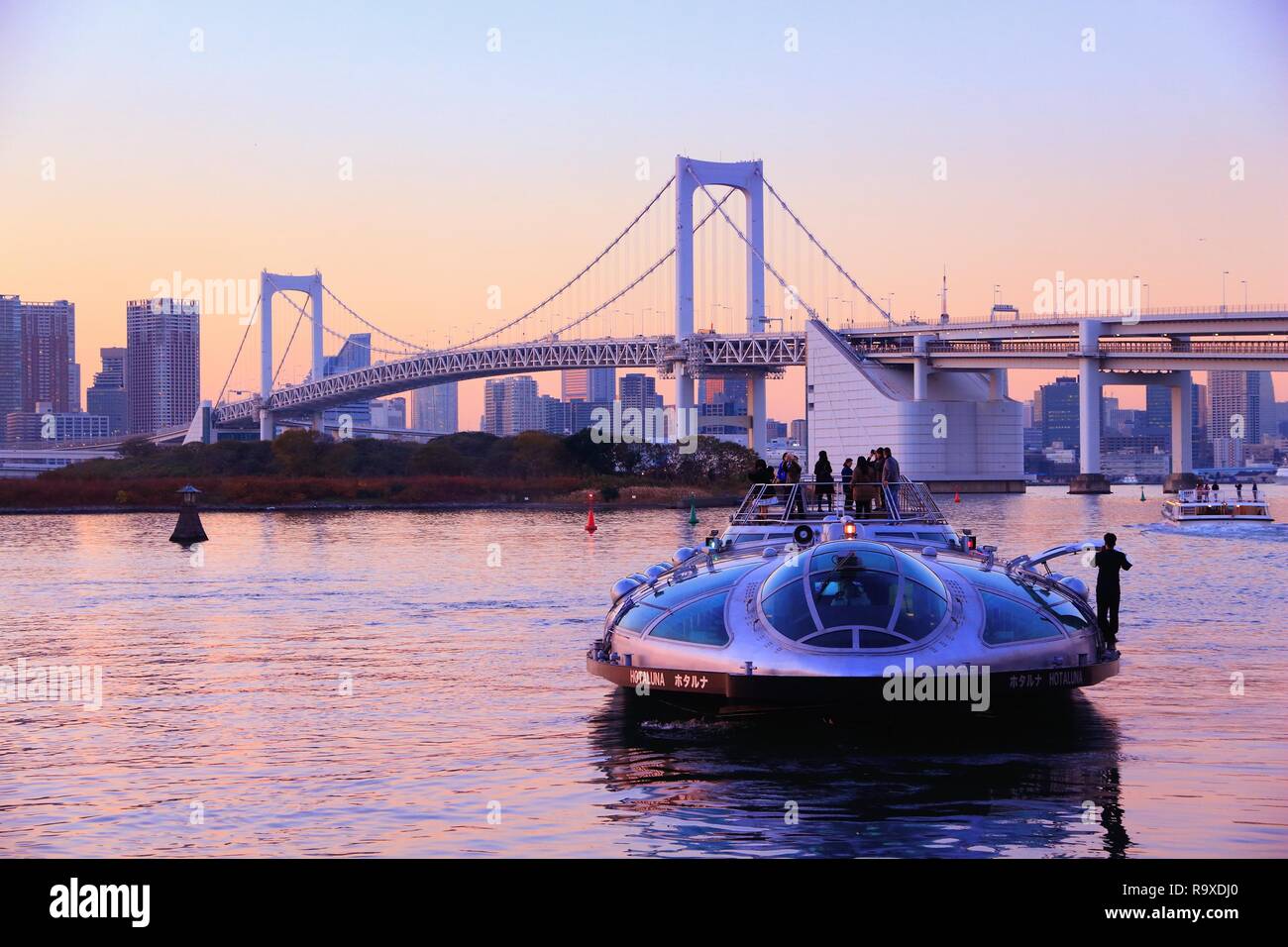 TOKYO, JAPAN - DECEMBER 2, 2016: People ride Hotaluna tour cruise boat in Tokyo, Japan. Tokyo is the capital city of Japan. 37.8 million people live i Stock Photo