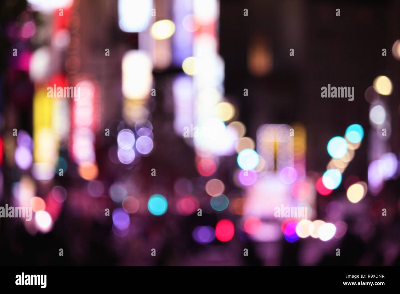 Night city lights - defocused Tokyo, Japan. Blurred neons. Stock Photo