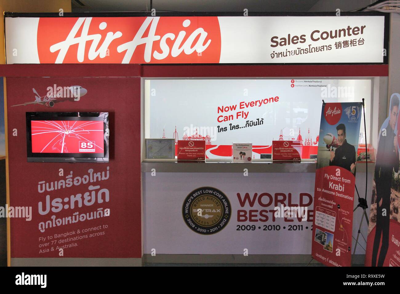 TRANG, THAILAND - DECEMBER 21, 2013: Air Asia ticket counter at Trang Airport in Thailand. Air Asia group flies 169 aircraft to 121 destinations. AirA Stock Photo