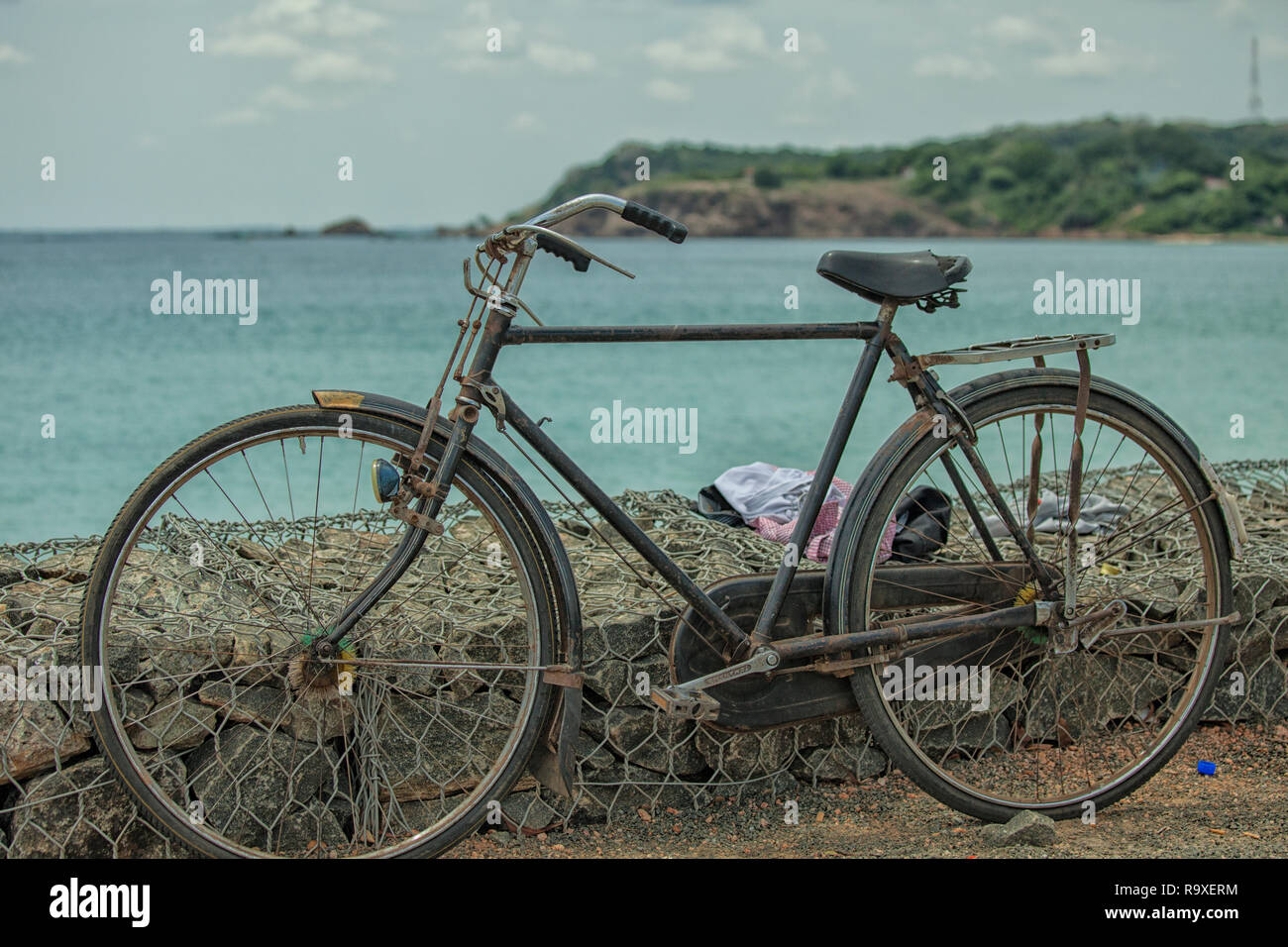 Parked bicycle on the beach of  Dutch Bay in Trincomalee, Sri Lanka Stock Photo