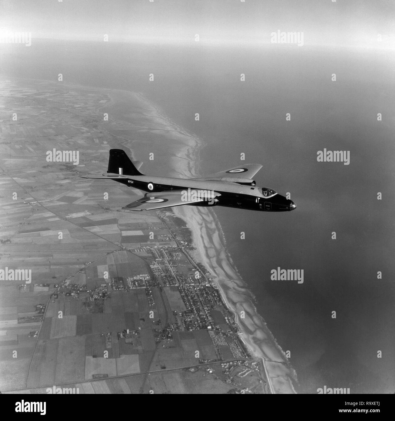 An English Electric Canberra B2 aircraft, serial number WP514, of the British Royal Air Force, in flight over the south coast of England in 1956. Stock Photo
