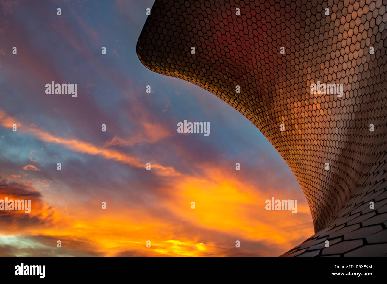 A sunset reflected on Museo Soumaya in Mexico City, Mexico Stock Photo