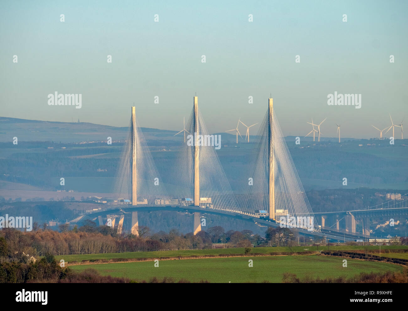 A view from West Lothian towards Fife showing the Queensferry Crossing with the Forth Road Bridge, right. Stock Photo