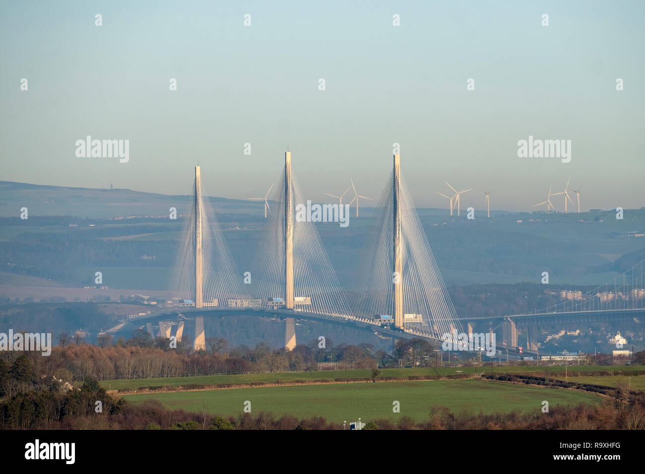 A view from West Lothian towards Fife showing the Queensferry Crossing with the Forth Road Bridge, right. Stock Photo