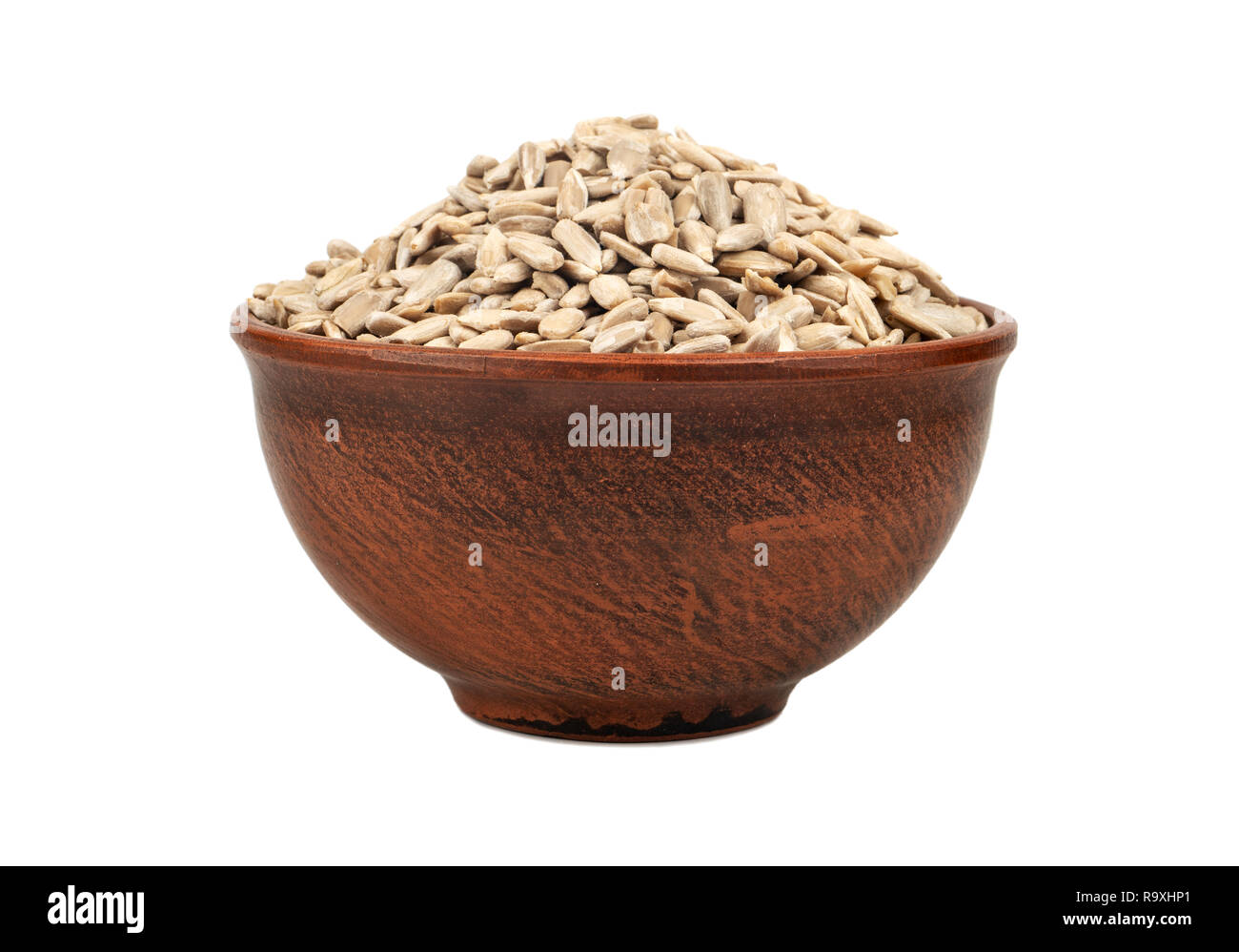 Sunflower seeds without shell in bowl isolated on white background