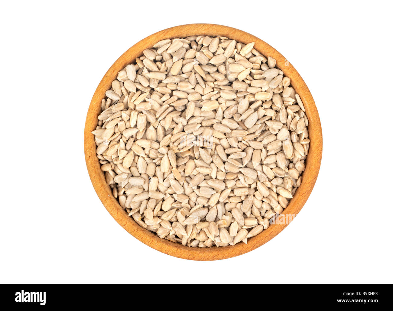 Sunflower seeds without shell in bowl isolated on white background, top