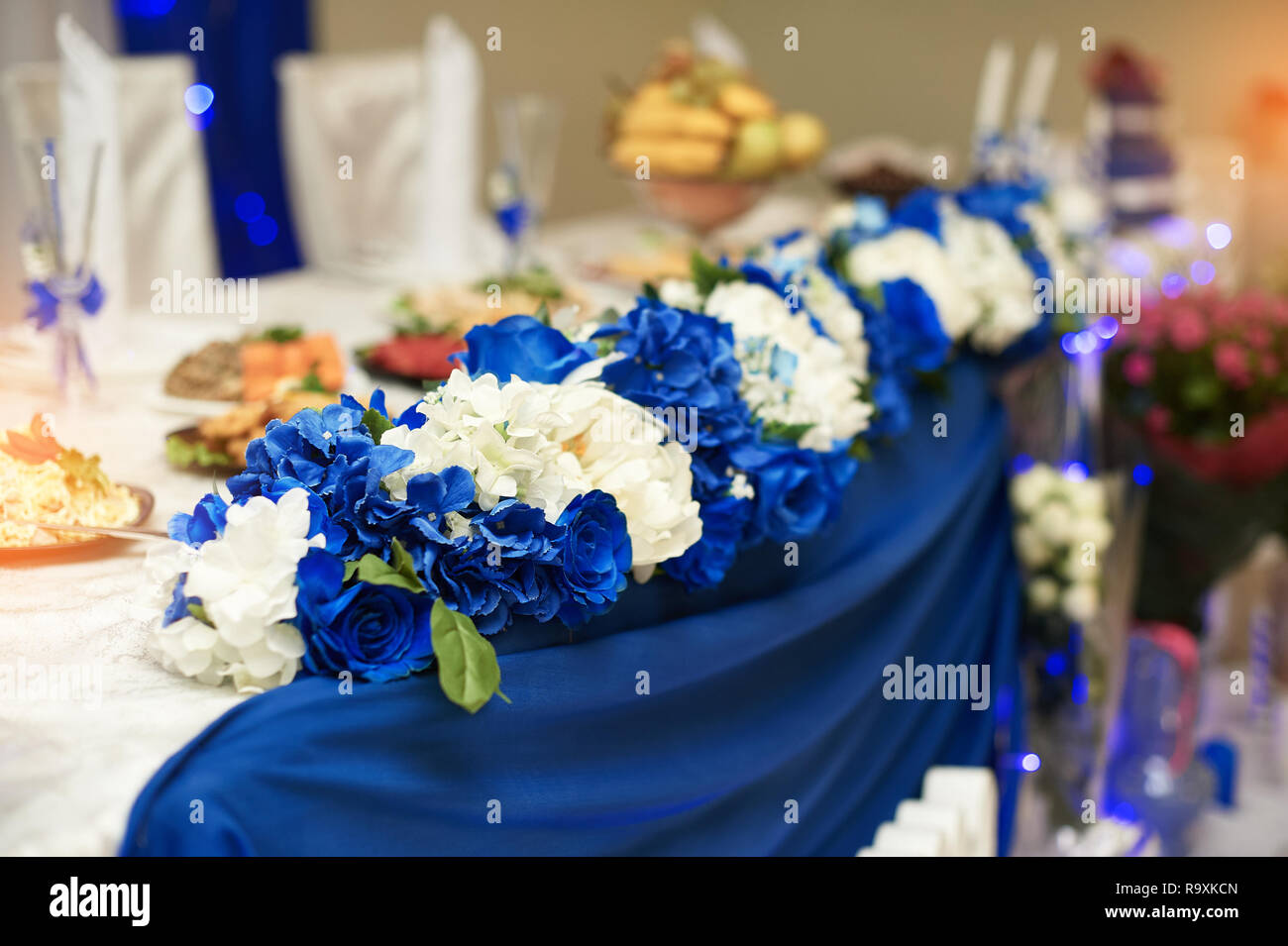 wedding decor of white flowers on the table of the bride and groom in the  restaurant Stock Photo - Alamy