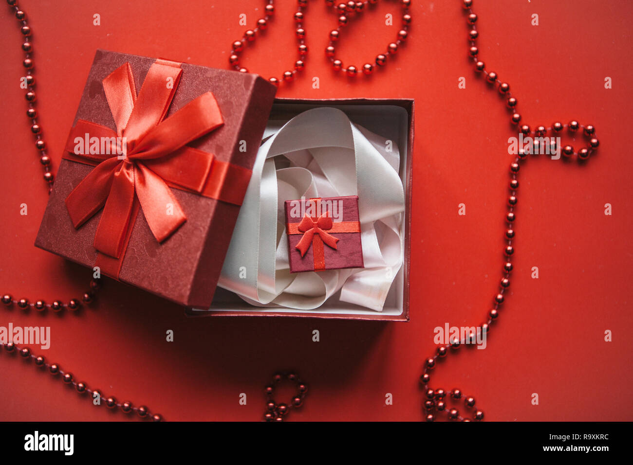 Red Inner Box The red box and inside it is another small box with a gift on a red ...