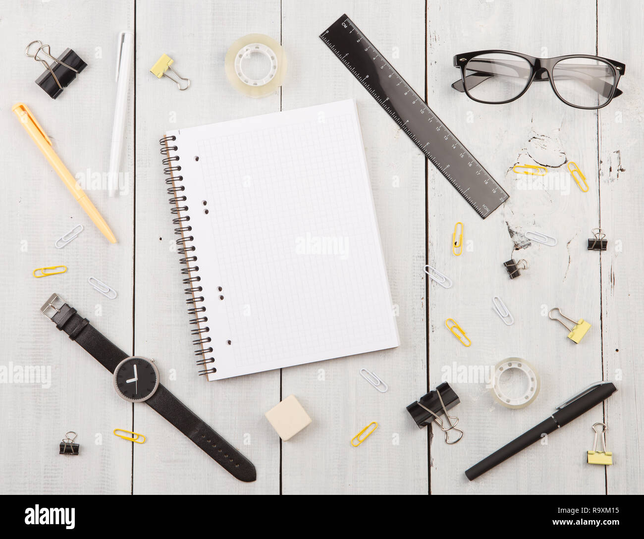 workplace with notepad, glasses, watch, pen etc. top view Stock Photo
