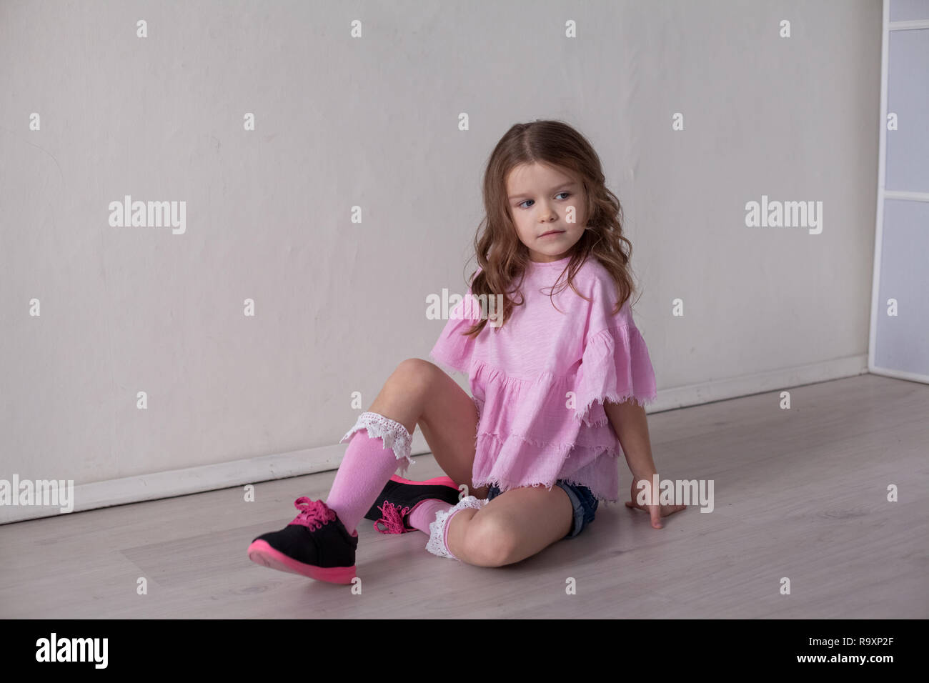 Portrait of a beautiful little girl in a pink dress five years Stock ...