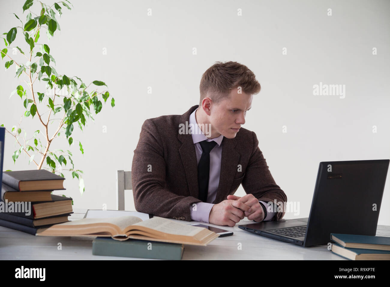 a man works in the Office at the computer business clerk Stock Photo