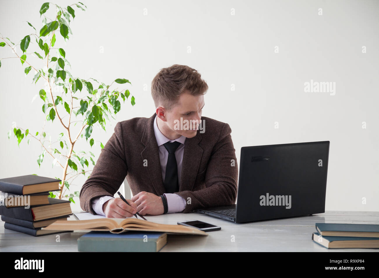 a man works in the Office at the computer business clerk Stock Photo
