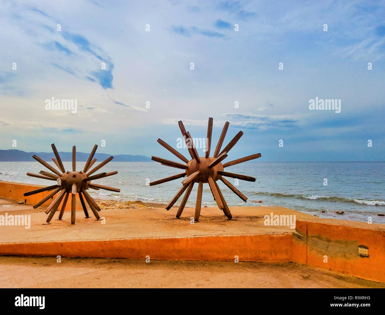 PUERTO VALLARTA, MEXICO - JANUARY 30, 2018 - “Eriza-Dos (Standing on End)” is rustic-looking sculpture of two sea urchins, sitting on Malecon, a prome Stock Photo
