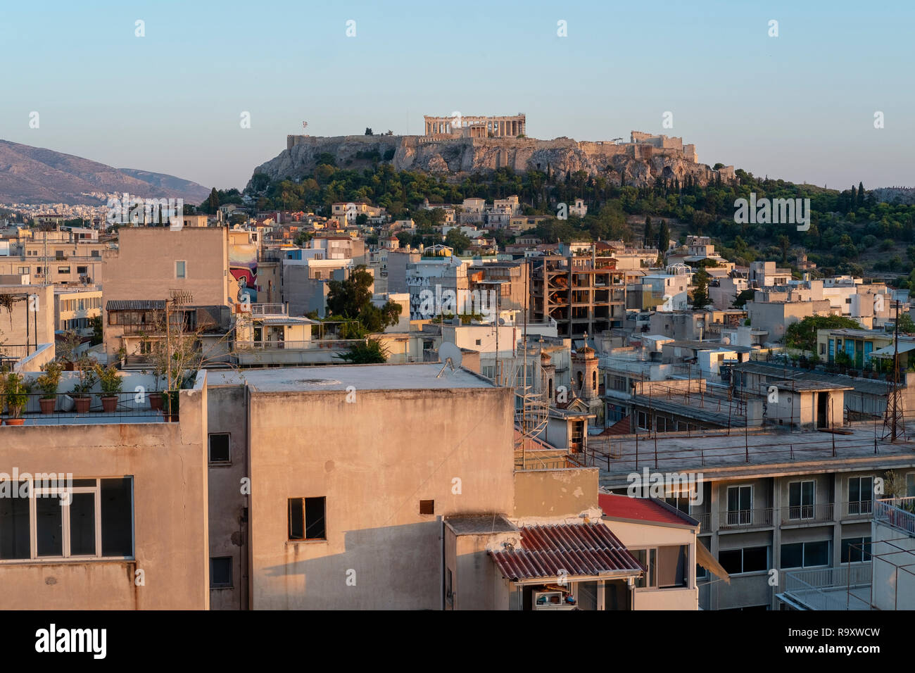 Golden light before sunset on a panoramic view of the rooftops of ...