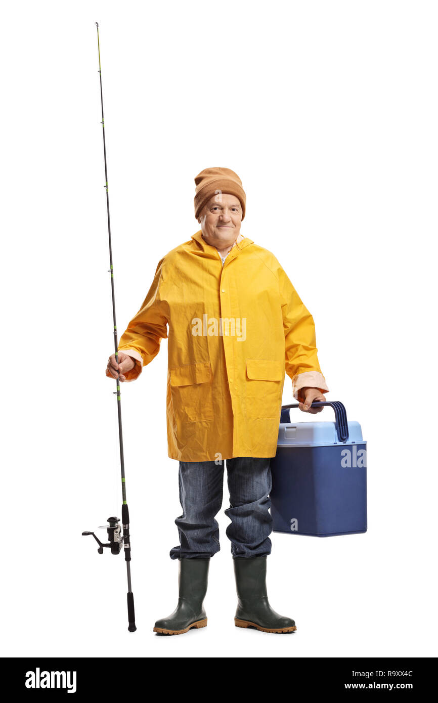 Full length portrait of a fisherman in a yellow raincoat holding a